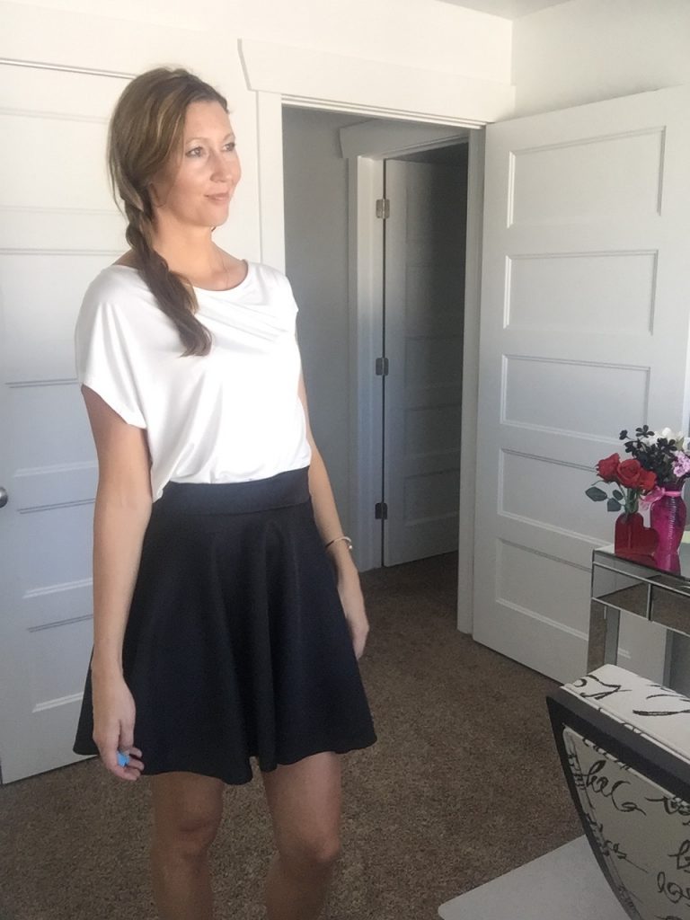 white t shirt and black skater skirt 