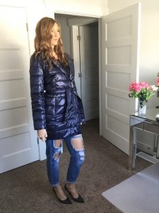 blue puffer coat and distressed jeans 