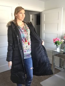 Long Black hooded coat, distressed jeans, and retro hippie shirt