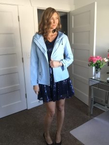 sky blue windbreaker jacket over blue sequin dress