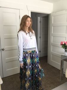 White sporty hoodie and ethnic print skirt