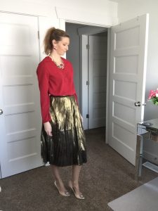red blouse and gold metallic skirt