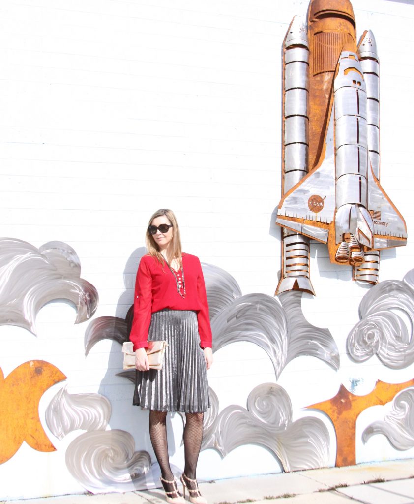 red blouse and silver pleated skirt 