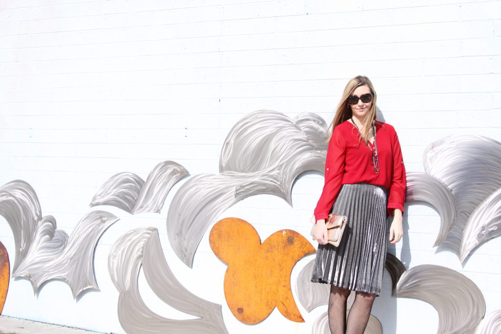 red blouse and silver pleated skirt 