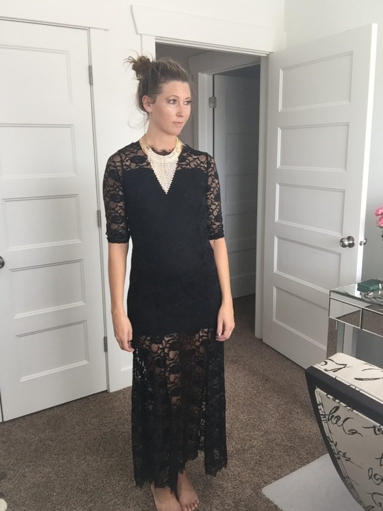 Black lace dress with elegant gold layered necklace