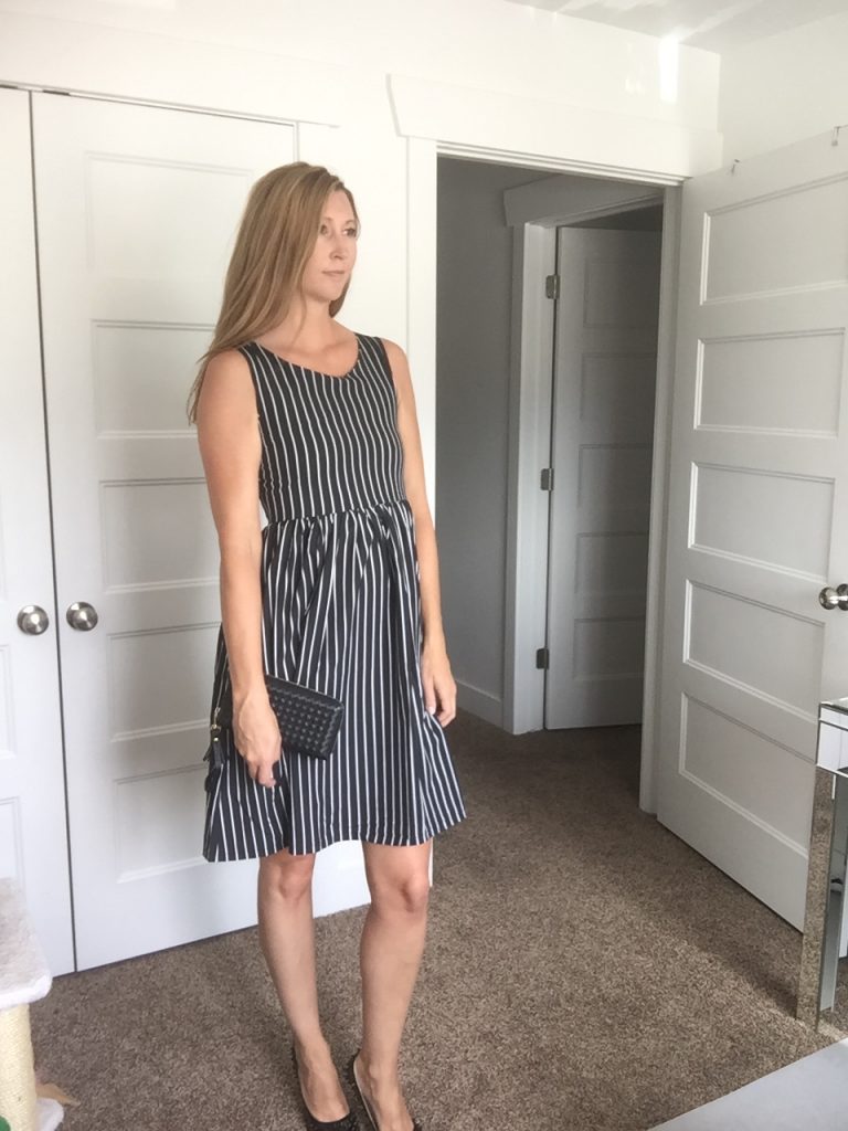 woman in Black and White Striped Sleeveless Dress