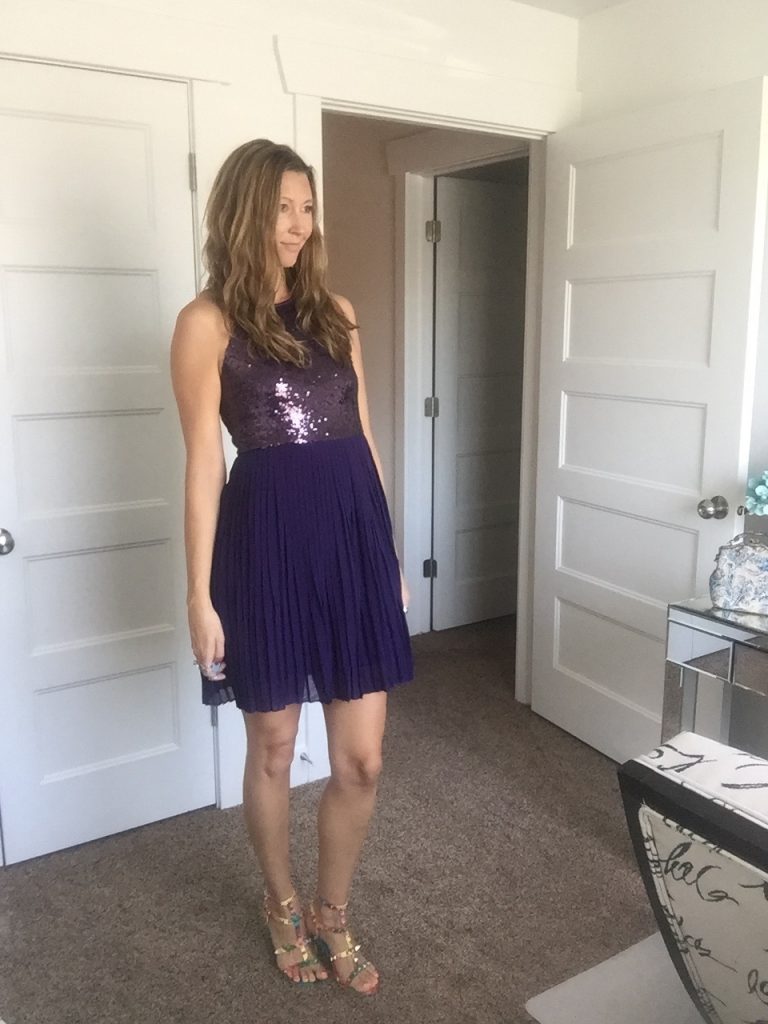 woman in purple sequin party dress